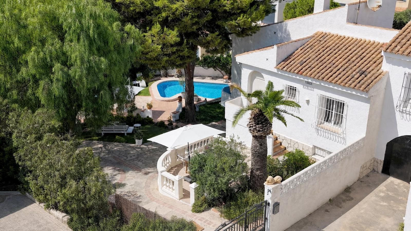 Our home from above, with the garden and pool